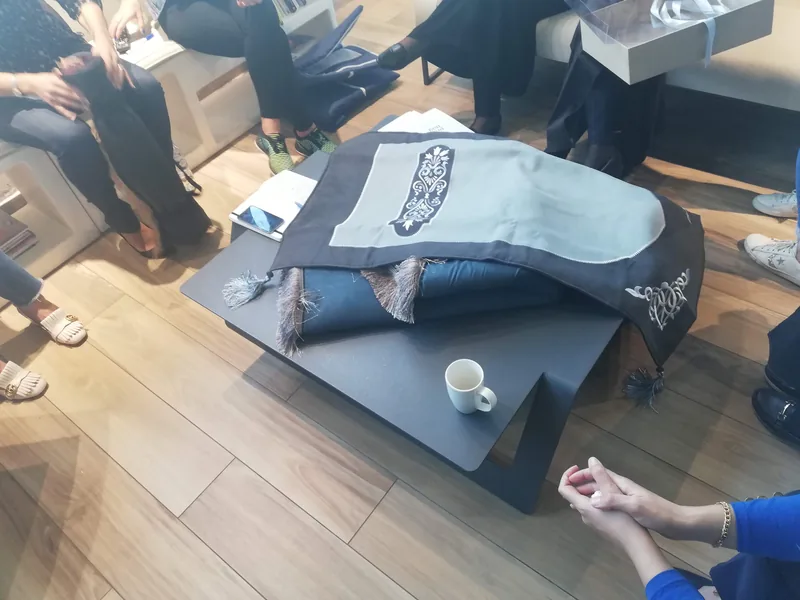 Prayer rug reviewed in a design session — one of nine product categories covered by the guides.